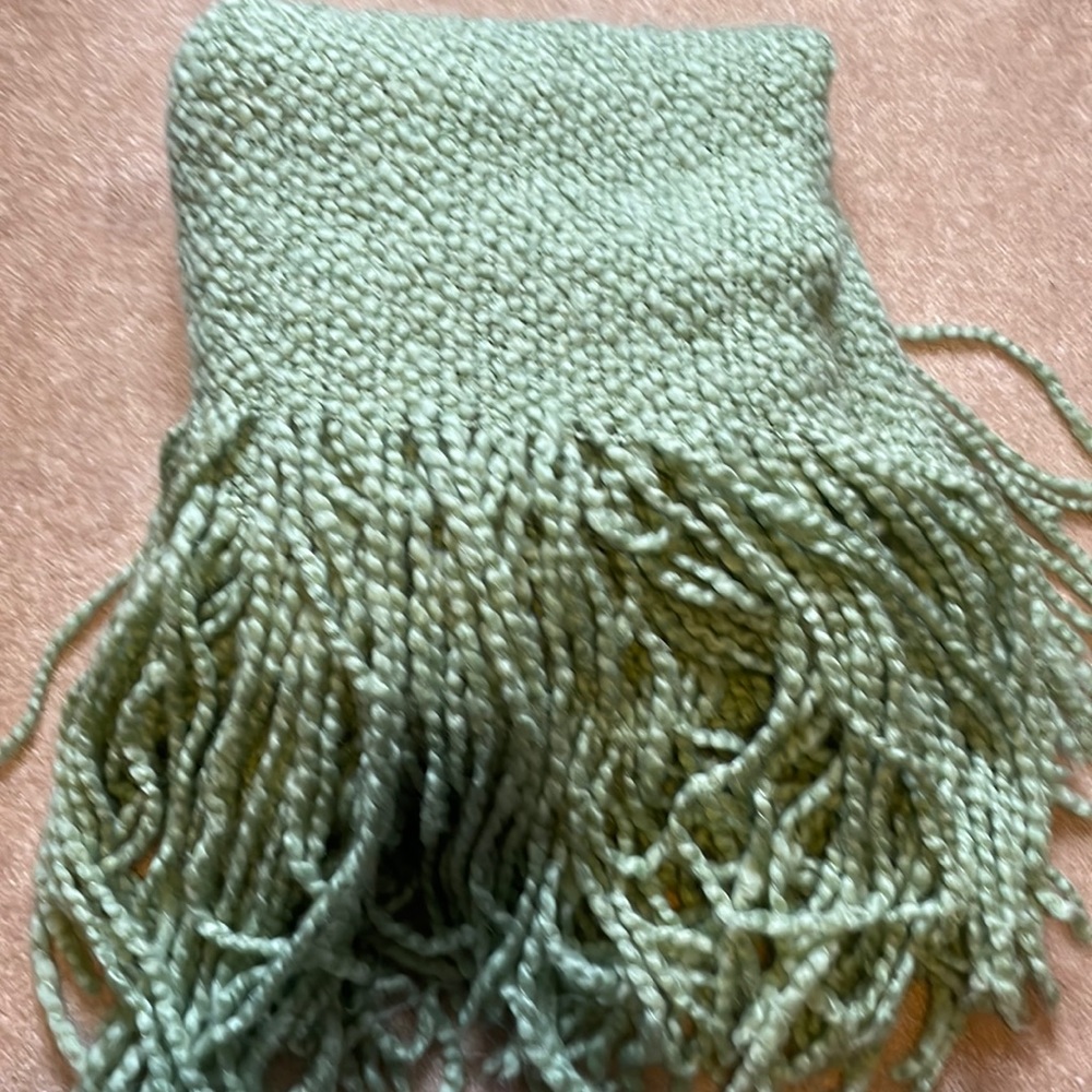 Soft green blanket with tassels